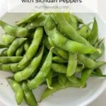 Edamame with Sichuan peppers in a white bowl