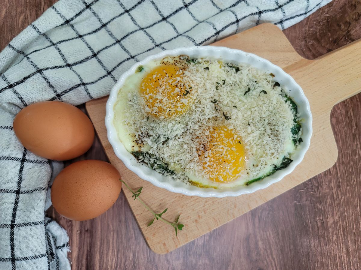 Easy Baked Eggs Florentine for Two in an white oval baking dish