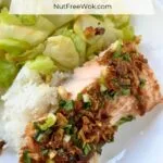 baked salmon served with stir-fried cabbage and rice.