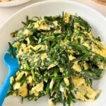 Chinese garlic chives stir fry with eggs in a white bowl