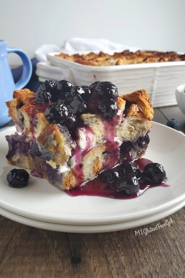 a piece of blueberry french toast casserole served on a white plate