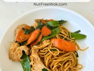 chicken and vegetables lo mein in a white plate