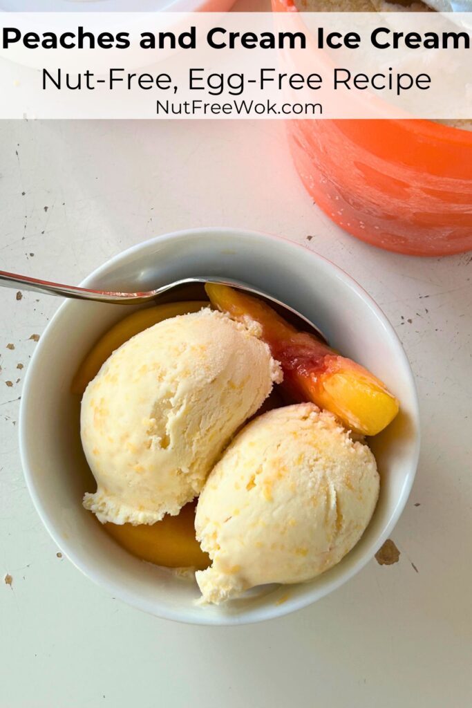 peaches and cream ice cream, served with slices of peaches in a white bowl