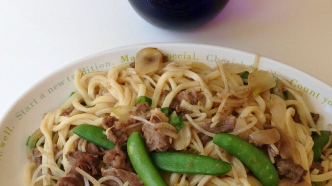 beef yaki udon served in a large white platter