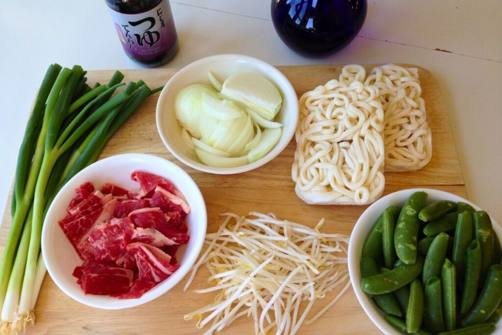 ingredients used in the recipe, scallions, onions, udon, beef, mung bean sprouts, sweet peas