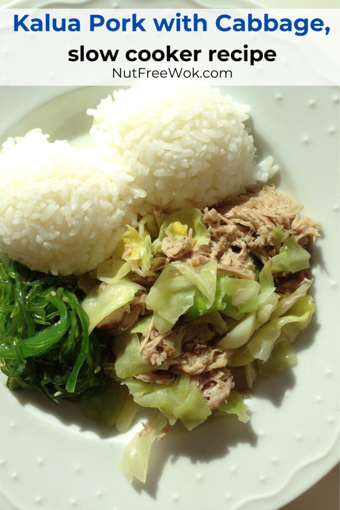overhead photo of kalua pork and cabbage plate with rice and seaweed salad