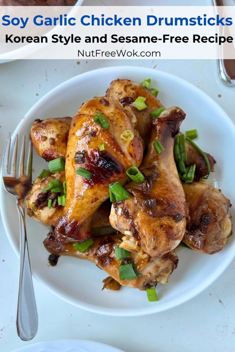 soy garlic chicken drumsticks served in a white serving bowl, with a fork on the side