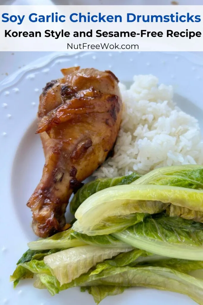 soy garlic chicken drumsticks served with rice and stirfried romaine lettuce on a white plate