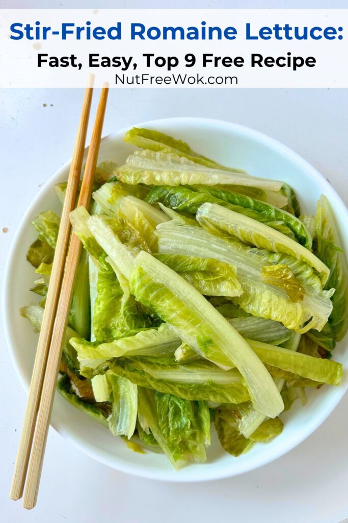 close up of stir-fried romaine lettuce in a white serving bowl, with chopsticks on the left