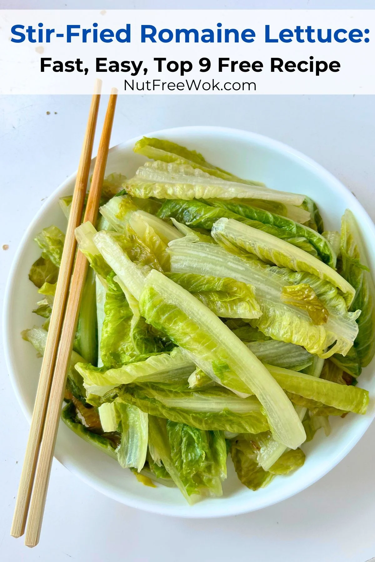 stir-fried romaine lettuce in a white serving bowl with chopsticks on the left