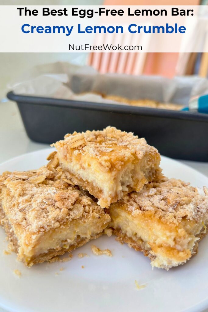 creamy lemon crumble bars arranged on a plate