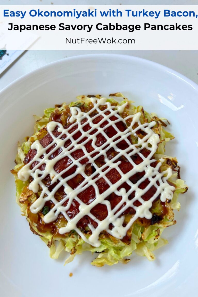 Okonomiyaki with turkey bacon, served with sauce and a drizzle of mayonaise in a criss-cross pattern.