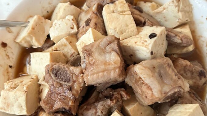 steamed spareribs with tofu in a white serving bowl