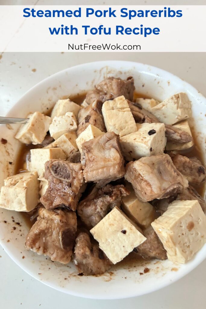 steamed pork spareribs with tofu in a large white serving bowl