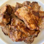 lamb loin chops, in a serving dish close up