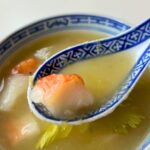 blue and white soup spoon with some Miso celery soup