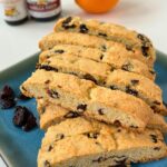 orange cherry biscotti on a square blue plate