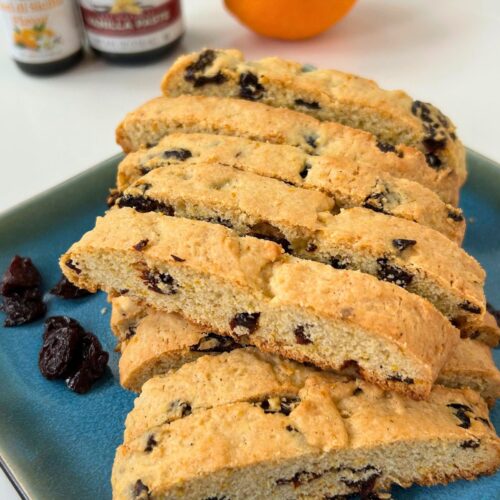 orange cherry biscotti on a square blue plate
