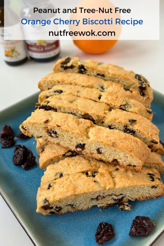 orange cherry biscotti on a blue plate
