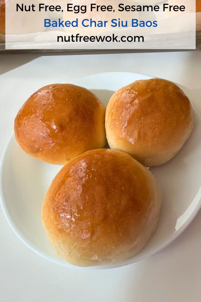 3 baked char siu baos served on a white cake plate