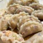 plate of steamed gok jai with a chicken and vegetable filling and translucent wheat starch wrapper